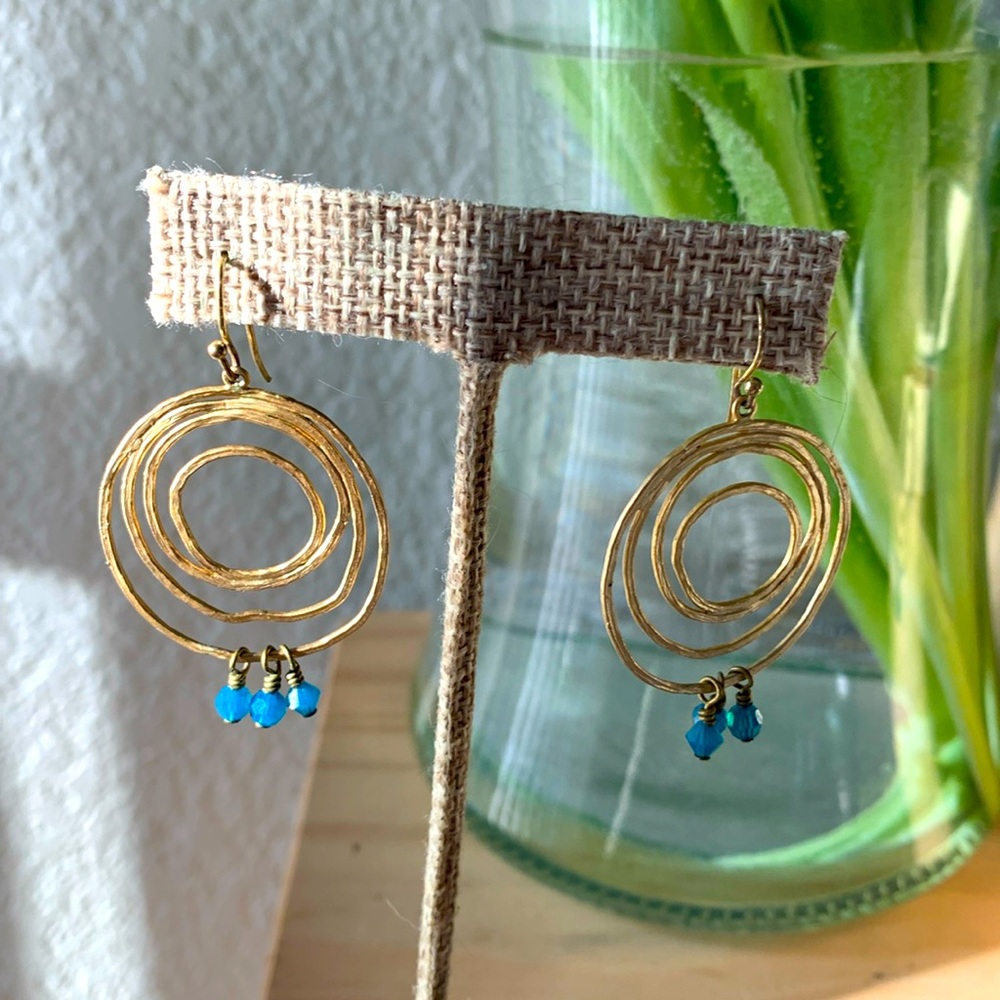 Gold dangle earrings with blue beading